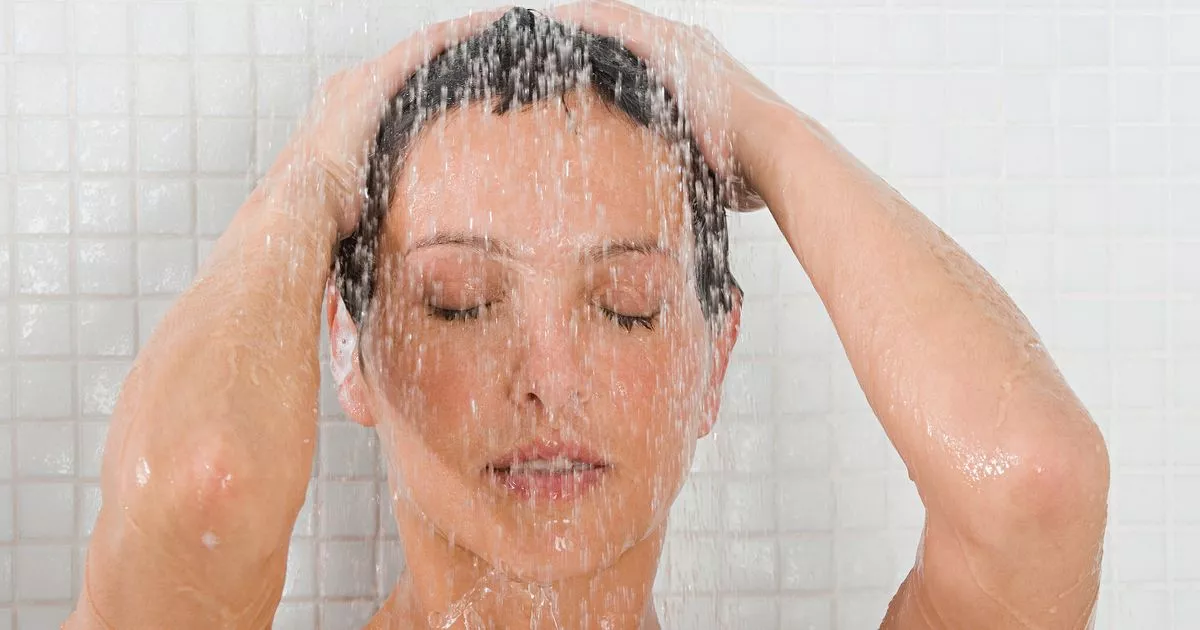 why do women take hotter showers